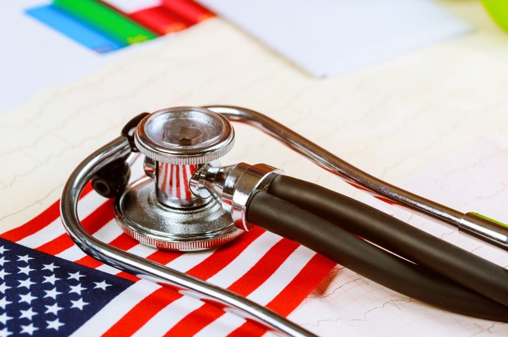 Stethoscope on American national flag American healthcare and medicine